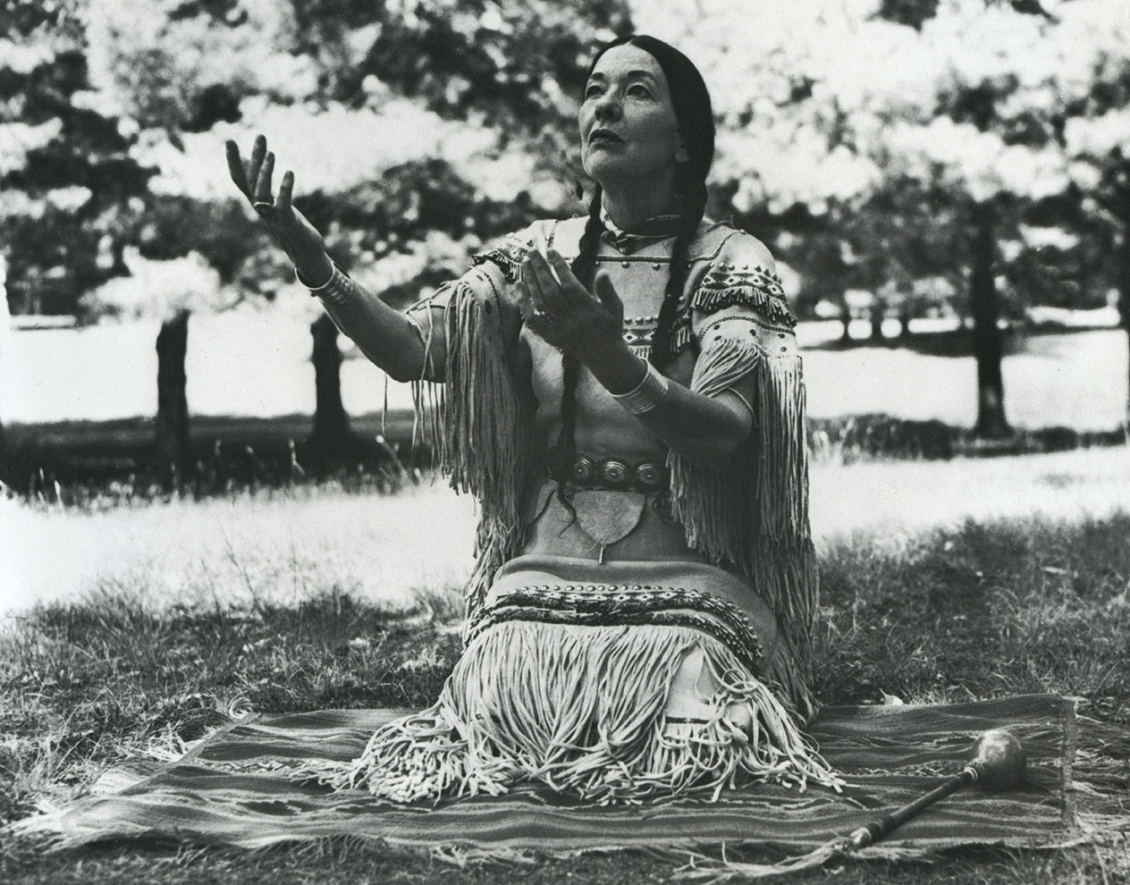 Te Ata seated on a blanket | Nash Library